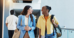 Laughing, students and women in college, hallway and friends with gossip, education and conversation. Happy, learners and people with scholarship for knowledge, chat or funny discussion in university