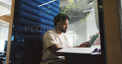 Buy stock photo Pod, reading and tablet with designer man in office for project feedback, post or update. App, information and privacy with employee person in cubicle of design workplace for planning or research