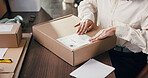 Hands, person and box label for ecommerce, shipping information and distribution. Package, sticker and woman in small business for delivery, priority mail and logistics with order in startup office