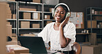 Small business, woman and laptop with headphones in logistics for inventory, music and shipping. Supply chain, black person and happy with tech for streaming playlist, online order or track delivery
