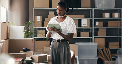 Buy stock photo Black woman, tablet and typing for dropshipping, logistics or supply chain with distribution schedule for boxes. Person, tech and review with package, app or notes for inventory management at startup
