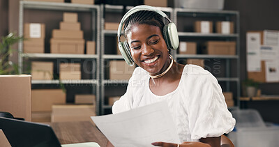 Buy stock photo Ecommerce, headphones or black woman in office with paper, stock control or music streaming at work. Logistics, admin or supplier in agency with laptop, radio or podcast subscription in supply chain.