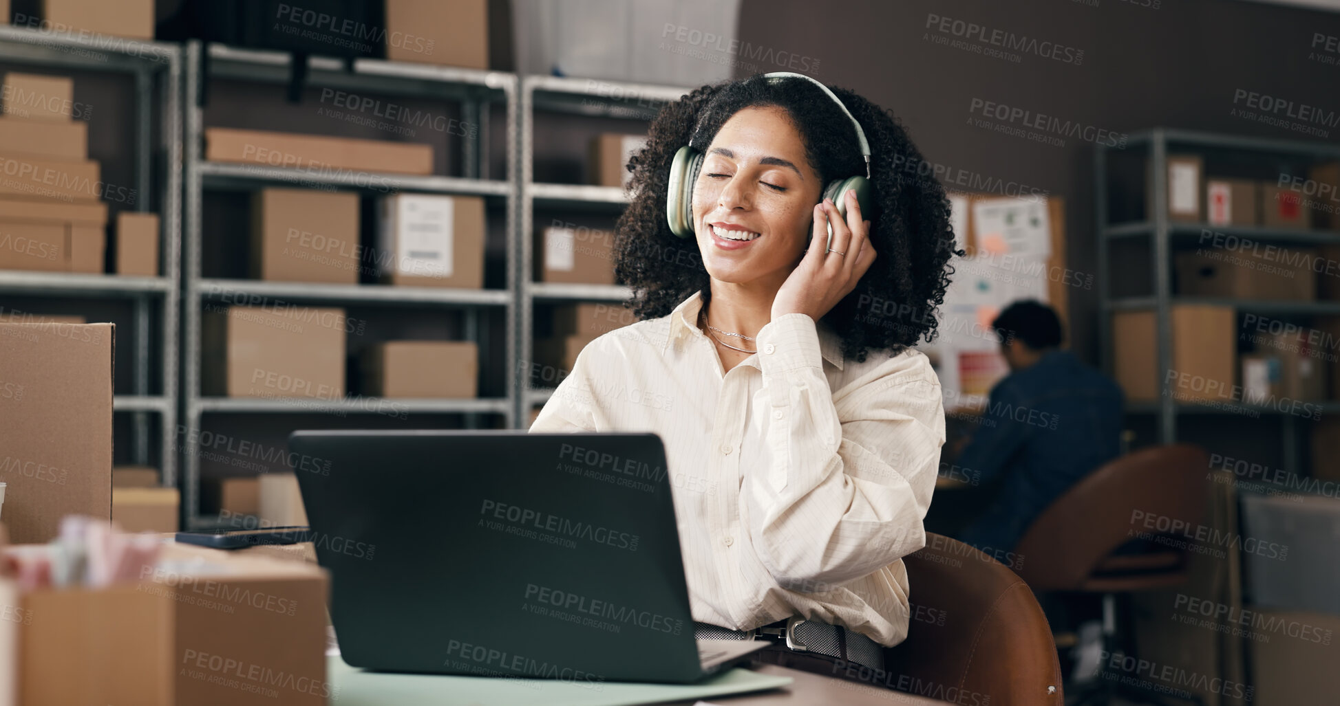 Buy stock photo Ecommerce, headphones or woman in office with laptop, inventory control or music streaming at work. Logistic, coworking or supplier in agency with tech, radio or podcast subscription in supply chain.