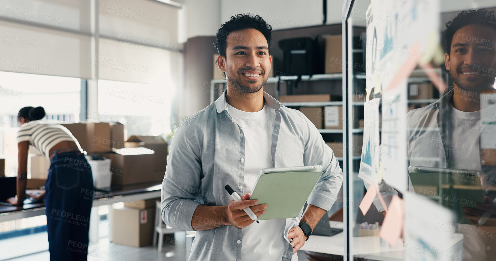 Buy stock photo Glass wall, logistics and man with tablet for thinking, ecommerce ideas or analysis. Technology, smile and entrepreneur with board for shipping, distribution strategy and vision with graphs in office