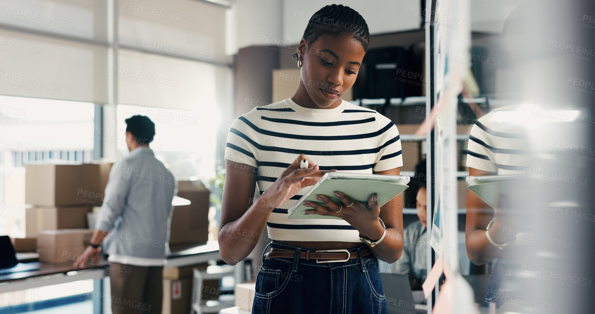 Buy stock photo Ecommerce, woman or scroll with tablet for planning, brainstorming logistics or shipping at glass wall. Person, browse or research with tech in office for supply chain strategy, delivery idea or goal