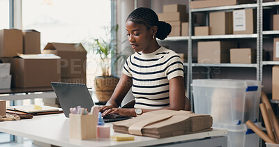 Buy stock photo Logistics, woman or typing with laptop in small business for delivery tracking, inventory or shipping. Supply chain, black person and tech in warehouse for order update, procurement email and reviews