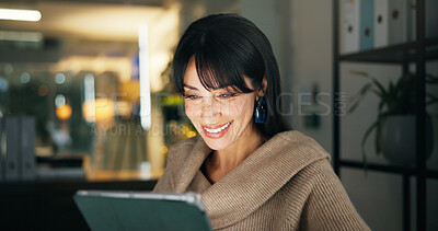 Buy stock photo Tablet, night and happy business woman in office, reading report or fact check for article. Company, journalist and mature editor with technology for news story, research and review on overtime