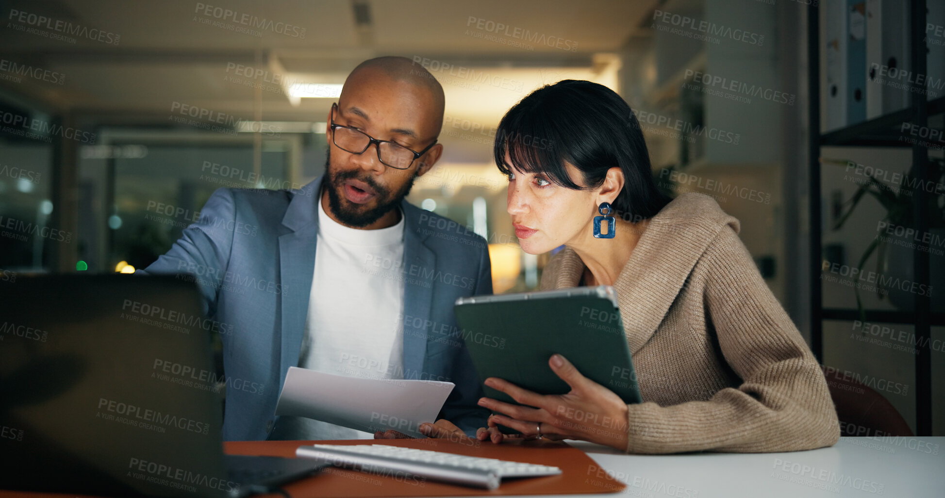 Buy stock photo Laptop, team and business people in office for report, collaboration and feedback. Tech, drafting proposal and research with discussion for proofreading, review and editing publication at night