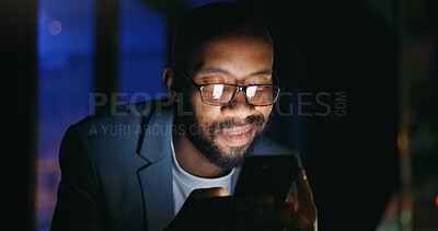 Buy stock photo Typing, night and black man on balcony with phone, online communication and good news on email. Smile, glasses and employee in city with tech, proposal approval and networking on late shift.