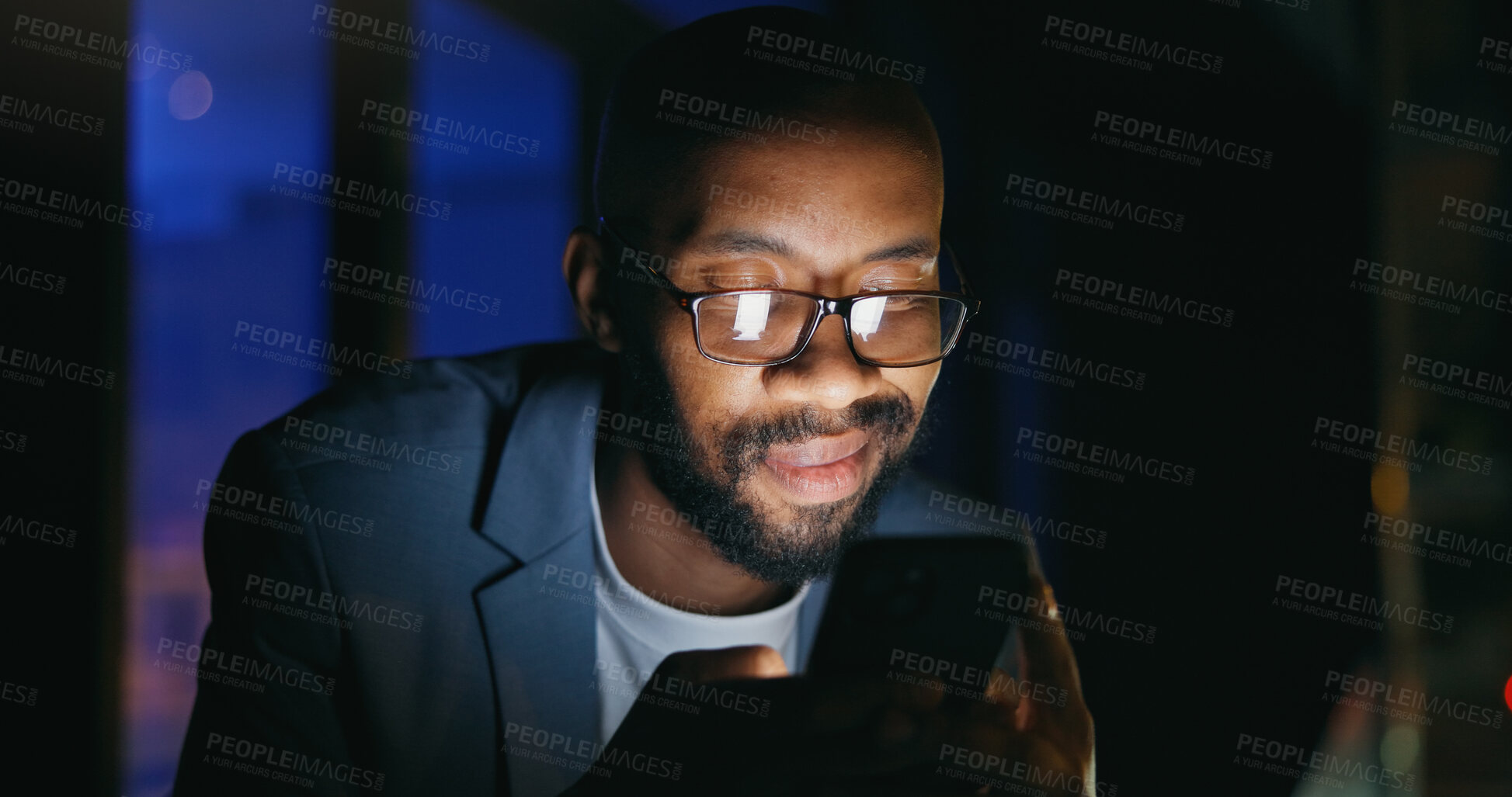 Buy stock photo Typing, night and black man on balcony with phone, online communication and good news on email. Smile, glasses and employee in city with tech, proposal approval and networking on late shift.
