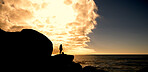 Sunset, space and silhouette of hiker on cliff thinking for hiking, adventure and travel outdoor. Banner, sky and person on mountain with reflection for exercise, fitness and trekking for sightseeing