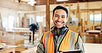 Man, carpenter and tablet in portrait at factory with confidence, smile and furniture manufacturing. Person, small business owner and happy with tech for woodwork, application and excited at workshop