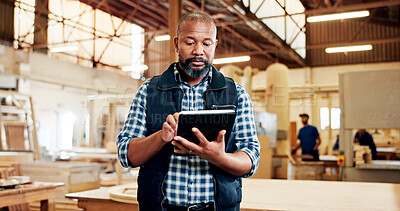 Buy stock photo Man, carpenter and tablet with scroll at factory, feedback or notes for furniture manufacturing. Mature person, technician and review with design for woodwork, app and insight for project at workshop