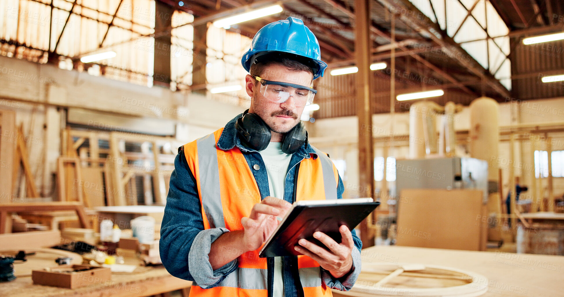 Buy stock photo Carpenter, online and man with tablet, workshop and plan for furniture production on web or research. Serious, entrepreneur and person with tech for inventory, scroll and project in small business