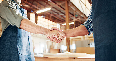 Buy stock photo People, carpenter and handshake with deal for agreement, partnership or b2b in workshop. Employees, colleagues or woodworker shaking hands with wood, timber or lumber for DIY project or furniture