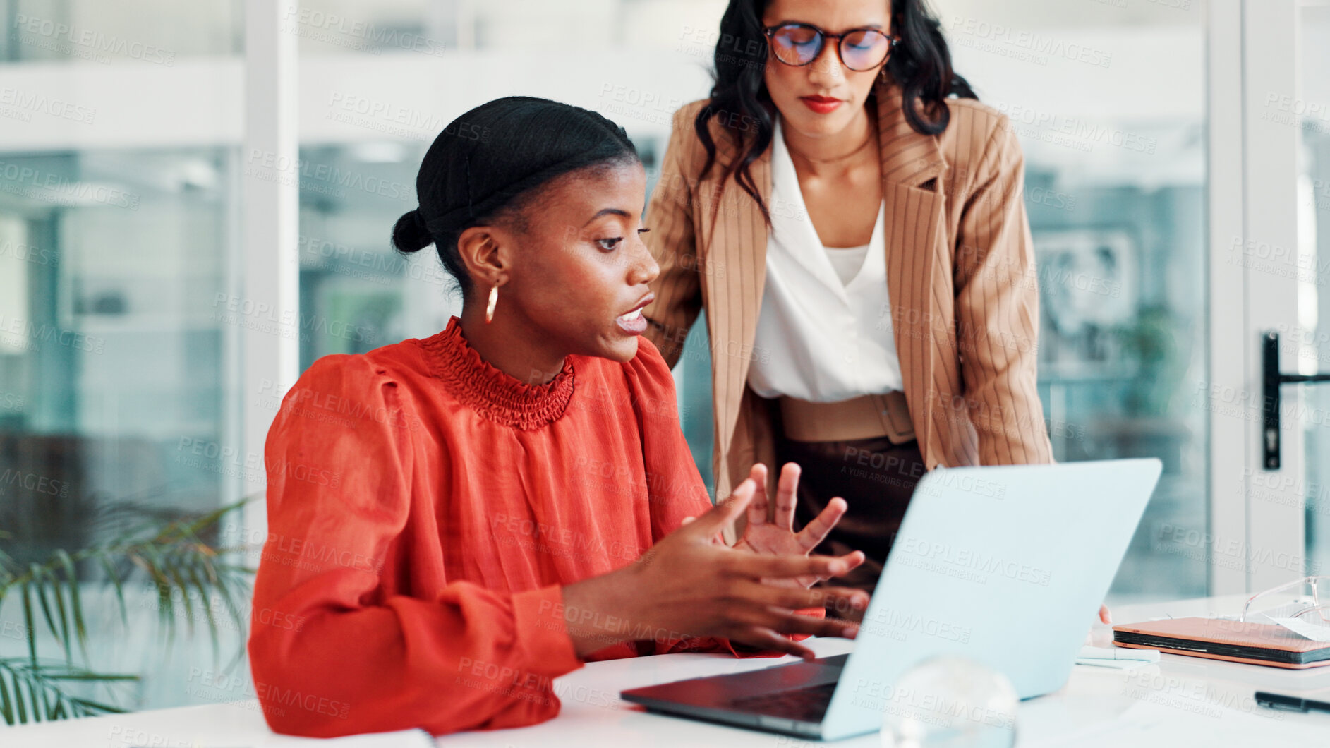 Buy stock photo Conversation, business women and laptop in office for feedback, news report and teamwork. Discussion, creative employees and journalist in meeting for research, advice and article for proofreading