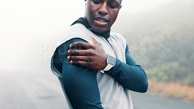 Buy stock photo Outdoor, shoulder pain and black man with fitness, tension and accident with burnout or training in fog. African person, nature mist and runner with exercise, injury or athlete with muscle strain