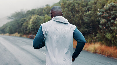 Buy stock photo Outdoor, fitness or man running on road, marathon training or practice for long distance competition. Morning mist, resilience challenge or athlete back with endurance workout, cardio or performance 