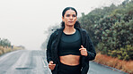 Nature, fitness and woman running on road, marathon training or practice for long distance competition. Morning mist, resilience and athlete with outdoor endurance challenge, wellness or performance