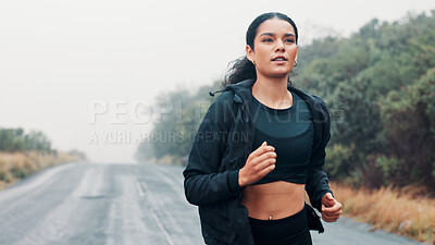 Buy stock photo Outdoor, fitness and athlete running on road, marathon training or practice for long distance competition. Morning mist, resilience challenge and woman with endurance workout, cardio and performance 