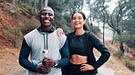 Exercise, portrait and smile of interracial couple outdoor together for cardio training, running or workout. Fitness, hands on hips and and trail with happy people in forest for health or wellness