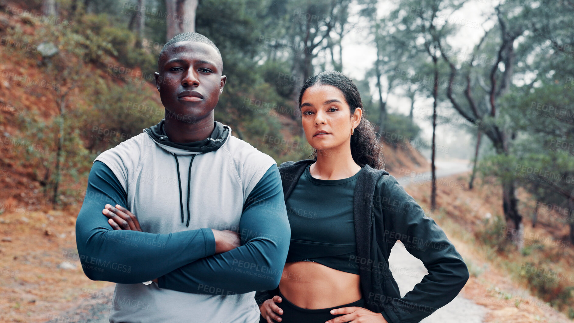 Buy stock photo Fitness, portrait and serious with interracial couple outdoor together for cardio training, running or workout. Arms crossed, confident and exercise with people in forest for health or wellness