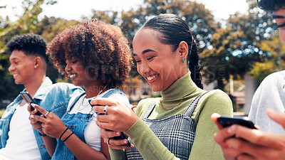 Buy stock photo Phone, students and friends at park for social media, connectivity or learning at university. Mobile, group and happy people at college campus for education app, networking online or text message