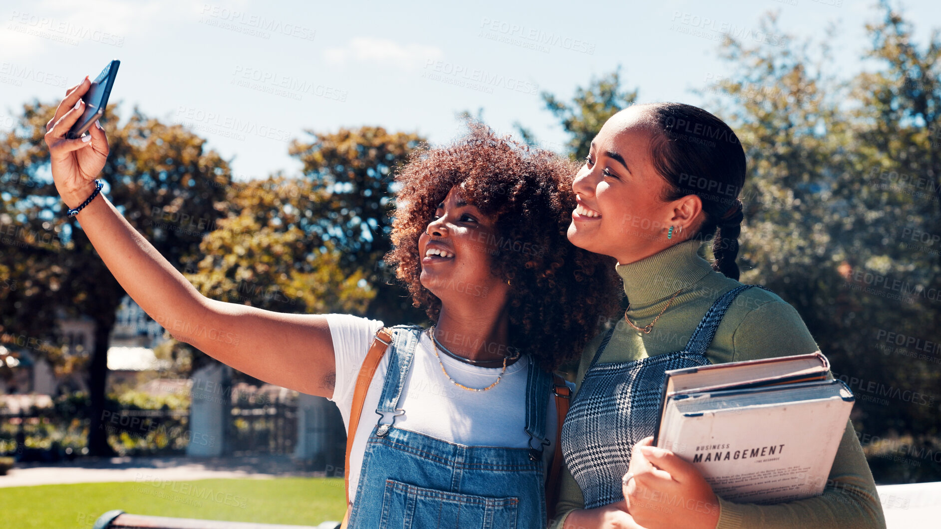 Buy stock photo Education, selfie and smile with women outdoor on college campus for memories or social media. App, books and photograph with happy student friends at university for profile picture post or update