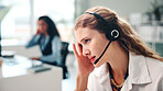 Telecom, woman and headache in office with stress for difficult customer, miscommunication or problem. Tired, person and coworking with migraine in call center for client feedback, mistake and error.