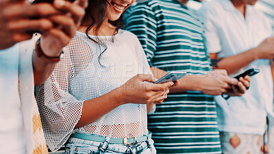 Buy stock photo Hands, phone and typing with happy people outdoor together for connection or social media browsing. App, contact and text message with friends in line for communication, online chat or reading