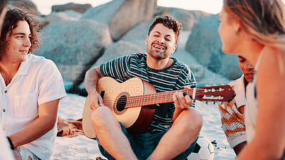Buy stock photo Guitar, friends and man with vacation, beach and singing with weekend break, relax and reunion. Seaside, musical instrument and people with happiness, listening and travel with summer holiday