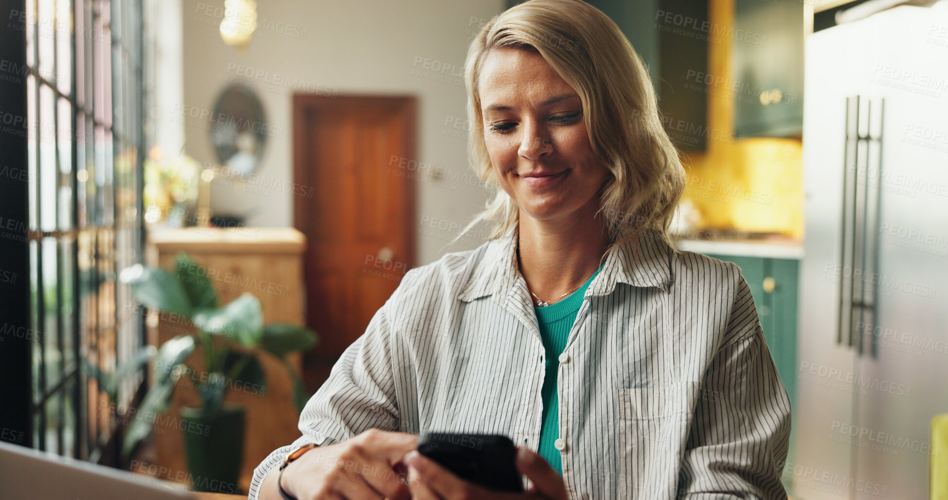 Buy stock photo Woman, reading and smile with phone for project draft, editing article and creative process in home. Remote work, freelancer and tech or laptop for proofreading with website editor or web blog post