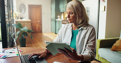 Buy stock photo Woman, laptop and typing with tablet for project draft, editing article and creative process in home. Remote work, freelance writer and tech for proofreading with document or blog post feedback