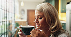 Coffee, smile and woman in home in morning for calm, peace and relax on weekend in living room. Memory, thinking and female person drinking warm beverage for break with reflection in apartment.