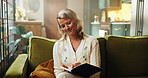 Book, break and writing with woman on sofa in living room of home for memories or planning. Diary, pen and relax with happy person in apartment for inspiration, journal entry or experience reflection