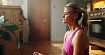 Woman, yoga and lotus meditation at house, breathing exercise and wellness in kitchen. People, zen and mudra with eyes closed for holistic fitness, routine and yogi on floor in morning at apartment