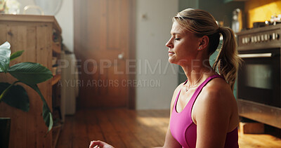 Buy stock photo Woman, yoga and lotus meditation at house, breathing exercise and wellness in kitchen. People, zen and mudra with eyes closed for holistic fitness, routine and yogi on floor in morning at apartment