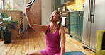 Exercise, pilates and selfie with woman on floor in kitchen of home for social media update. App, fitness and photograph with happy person in apartment for communication, holistic health or wellness