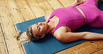 Woman, yoga and savasana on floor, home and eyes closed for meditation with breathing exercise in morning. Person, above and corpse pose on mat, mindfulness and zen with holistic fitness at apartment