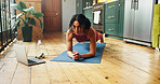 Woman, fitness and pilates with laptop for online tutorial, exercise or health tips in home. Active, female person or plank with computer on mat for virtual class, pilates or yoga guide in house