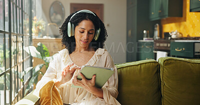 Buy stock photo Headphones, tablet and woman on sofa in house with listening to music, radio or song on app. Digital technology, relax and female person streaming playlist, podcast or album online in living room.