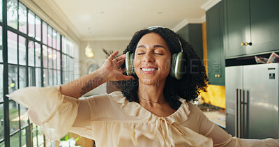 Buy stock photo Dance, music and smile of woman in kitchen of home for energy, listening or streaming radio. Audio, break and headphones with happy person in apartment for song entertainment or weekend playlist