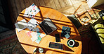 Above, table and creative setup with swatches at house for research, paint choice and interior design. Tech, color palette and fabric samples for shade comparison, texture coordination and renovation