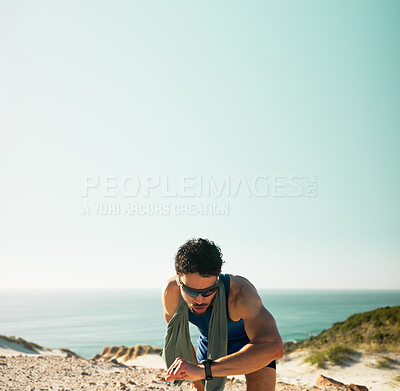 Buy stock photo Fitness, break and man with smart watch by beach, mockup space and check heart rate for training. Running pause, track distance and athlete with tech to count steps, sunglasses and monitor rest time