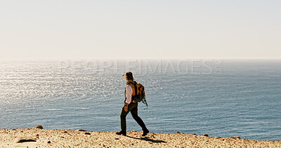 Buy stock photo Horizon, hiking and man with view for travel, adventure and fitness for journey with backpack. Male person, trekking and explore for exercise, eco tourism and nature space for holiday or vacation