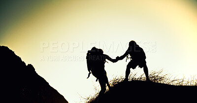 Buy stock photo Hiking, silhouette and friends on mountain with support, together or motivation for exploration goals. Adventure, aid or people outdoor with climb, endurance or helping hand for trekking milestone.