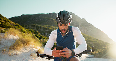Buy stock photo Fitness, cycling and man with phone in nature for networking, chatting or connectivity with training. Sports, cyclist and athlete with cellphone for texting, communication or contact on mobile app.