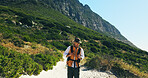 Exercise, hiking and mountains with man outdoor to explore for adventure hobby or backpacking. Fitness, health and travel with hiker person walking in nature environment for trekking or tourism