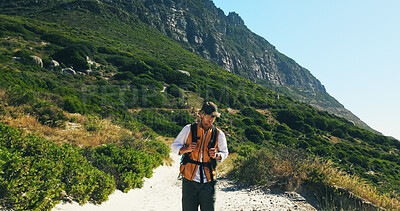 Buy stock photo Exercise, hiking and mountains with man outdoor to explore for adventure hobby or backpacking. Fitness, health and travel with hiker person walking in nature environment for trekking or tourism