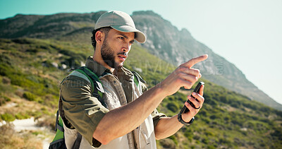 Buy stock photo Outdoor, hiking and man with cellphone, pointing and destination with app for direction. Healthy person, traveller and hiker with smartphone, location and gesture with navigation and browsing route